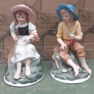 Porcelain figurines: farmer child holding carrrots, farmer girl w/ apples pair